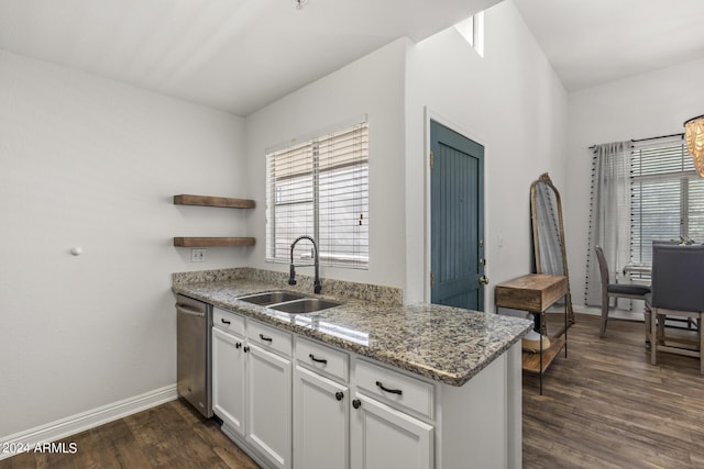 kitchen with baseboards, open shelves, a sink, and a wealth of natural light