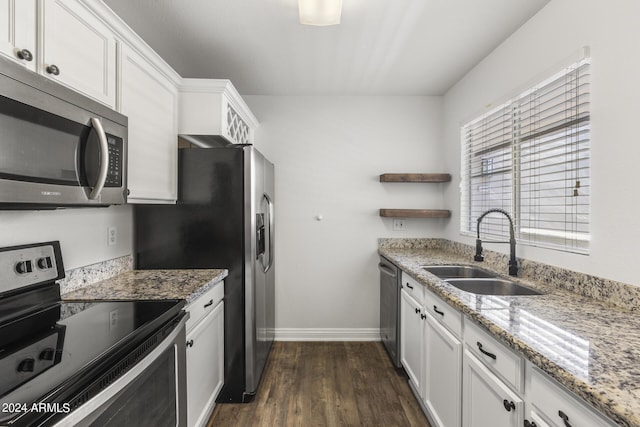 kitchen with open shelves, a sink, stainless steel appliances, white cabinets, and baseboards