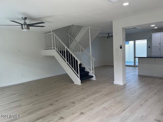 interior space featuring light hardwood / wood-style flooring and ceiling fan