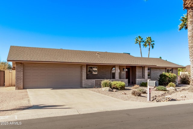 ranch-style home featuring a garage