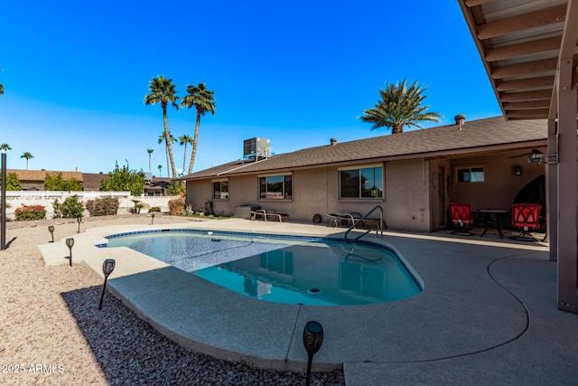 view of swimming pool featuring central AC and a patio