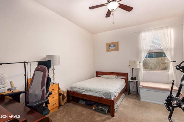 carpeted bedroom featuring vaulted ceiling and ceiling fan