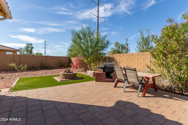 view of patio with a fire pit