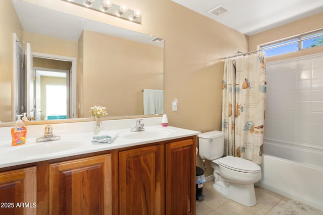 full bath with toilet, a healthy amount of sunlight, a sink, and tile patterned floors