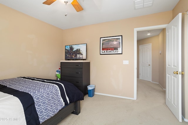 bedroom featuring baseboards, visible vents, ceiling fan, and light colored carpet