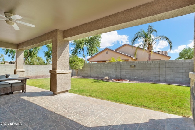 view of patio featuring a fenced backyard and ceiling fan