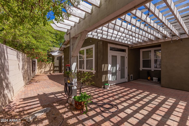 view of patio featuring french doors and a pergola