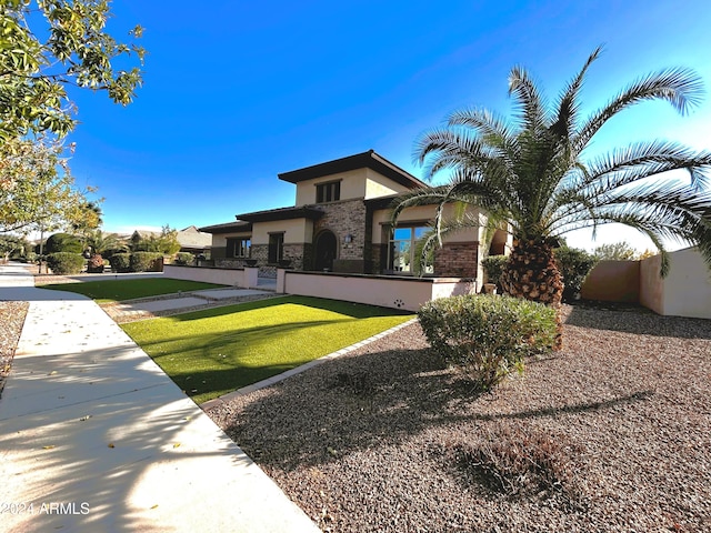 view of front facade with a front lawn