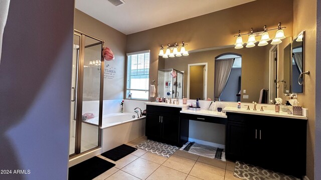 bathroom with shower with separate bathtub, vanity, and tile patterned floors