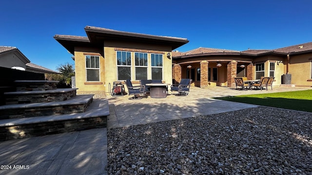 back of house with a patio