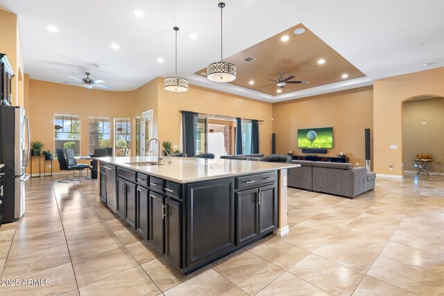 2285 E Mead Dr, Gilbert, AZ 85298 - kitchen featuring a ceiling fan, appliances with stainless steel finishes, a sink, recessed lighting, and arched walkways