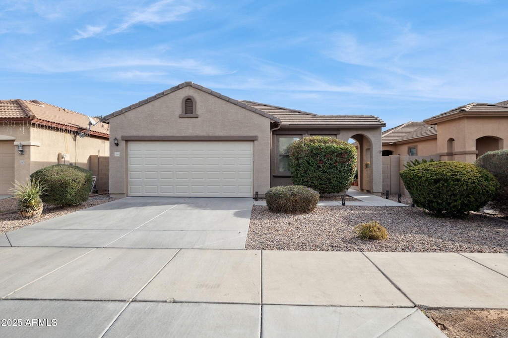 ranch-style home featuring a garage