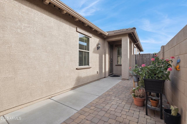 property entrance with a patio