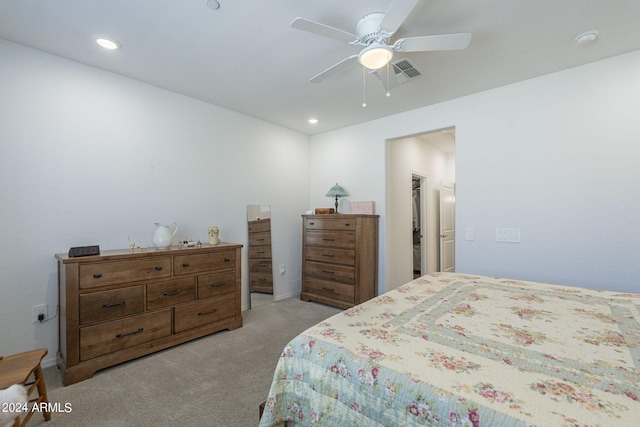 bedroom with ceiling fan and light carpet