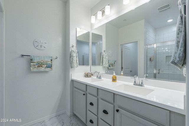 bathroom featuring walk in shower and vanity