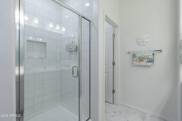 bathroom featuring an enclosed shower