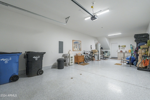 garage featuring water heater, a garage door opener, and electric panel