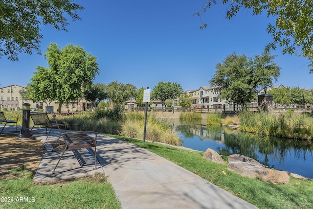 view of community with a water view