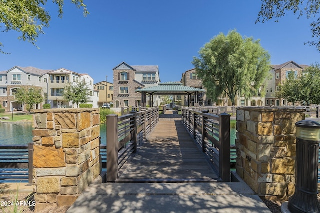 exterior space with a water view and a gazebo