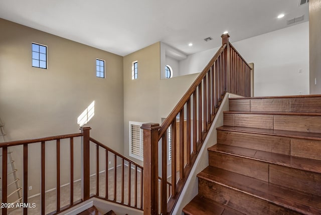 stairs with recessed lighting and visible vents