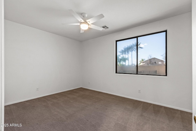 unfurnished room featuring visible vents, baseboards, ceiling fan, and carpet floors