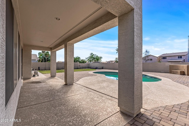 view of patio featuring a fenced backyard and a fenced in pool