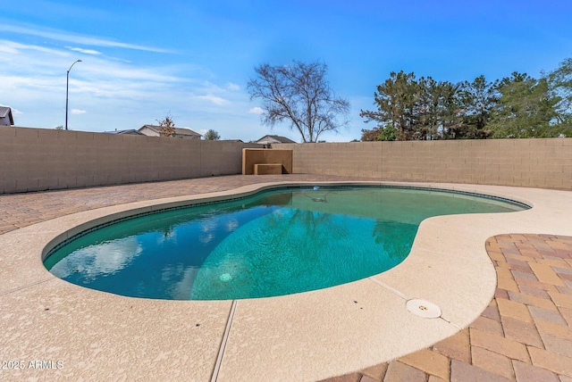 view of pool with a patio area, a fenced in pool, and a fenced backyard