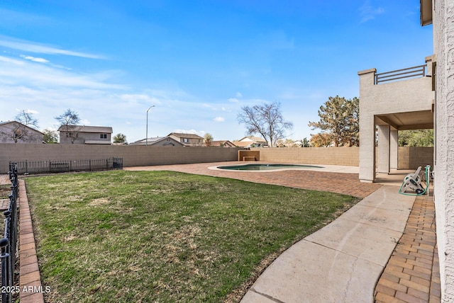 view of yard with a fenced in pool, a patio, and a fenced backyard