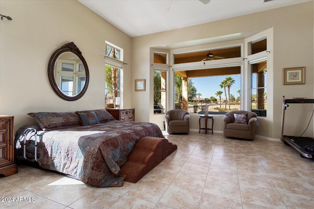 tiled bedroom featuring ceiling fan