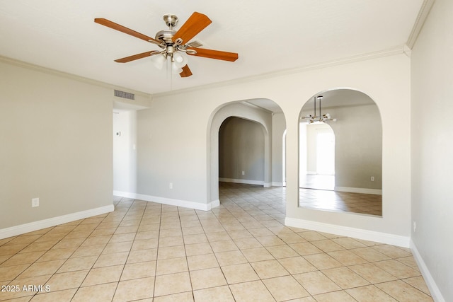 spare room featuring ceiling fan, light tile patterned floors, and crown molding