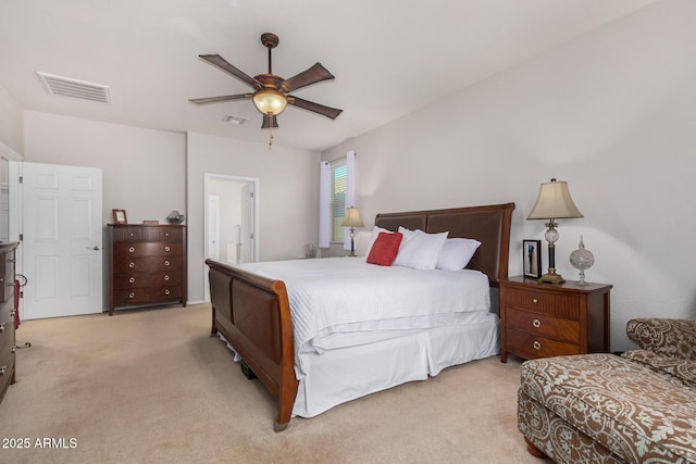 bedroom with ceiling fan and light colored carpet