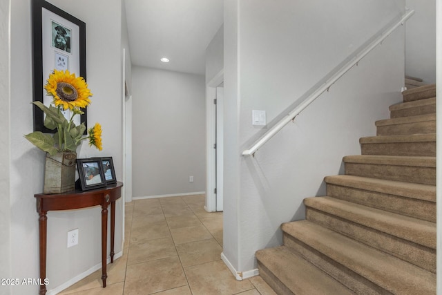 staircase featuring tile patterned floors