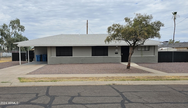 view of front of property with a carport