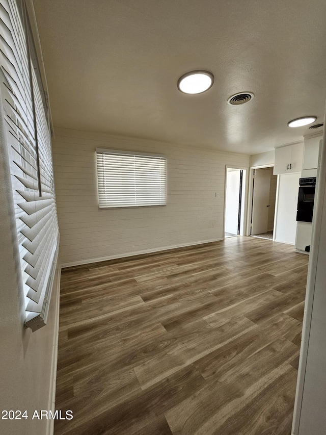 unfurnished room featuring dark hardwood / wood-style floors