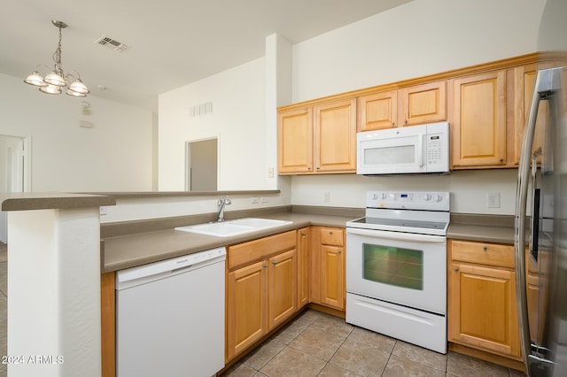 kitchen featuring a sink, a peninsula, white appliances, visible vents, and light tile patterned floors