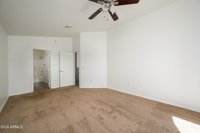 unfurnished bedroom featuring ensuite bath, carpet floors, baseboards, and visible vents
