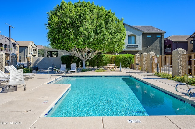 view of swimming pool featuring a patio