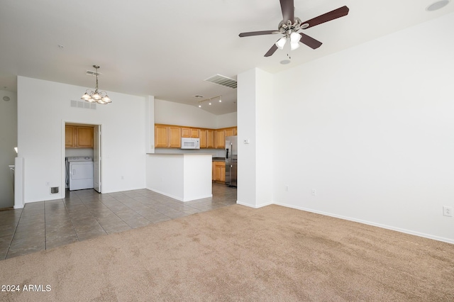unfurnished living room with independent washer and dryer, visible vents, vaulted ceiling, tile patterned flooring, and carpet flooring