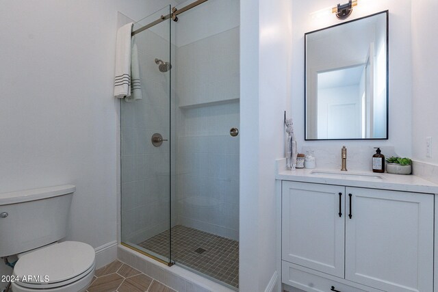 6926 N 177th Pl, Waddell, AZ 85355 - bathroom with toilet, a shower stall, vanity, tile patterned flooring, and baseboards
