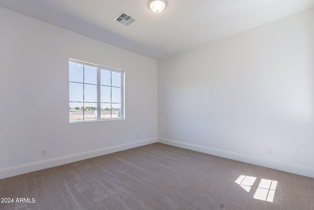 6926 N 177th Pl, Waddell, AZ 85355 - empty room featuring light carpet and baseboards