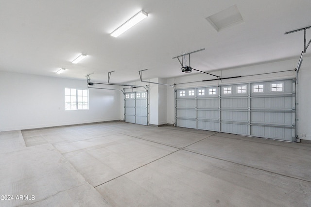 6926 N 177th Pl, Waddell, AZ 85355 - garage with a garage door opener and baseboards