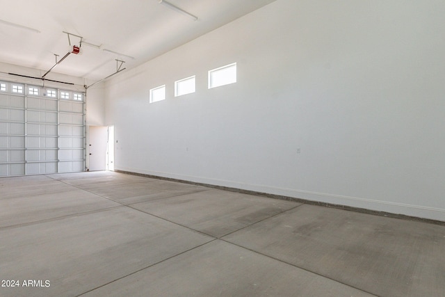 6926 N 177th Pl, Waddell, AZ 85355 - garage with a garage door opener and baseboards