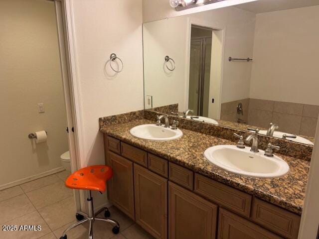 7609 E Indian Bend Rd Unit 1012, Scottsdale, AZ 85250 - bathroom featuring tile patterned floors, double vanity, and toilet