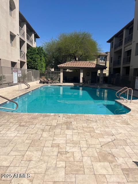7609 E Indian Bend Rd Unit 1012, Scottsdale, AZ 85250 - community pool featuring a patio area