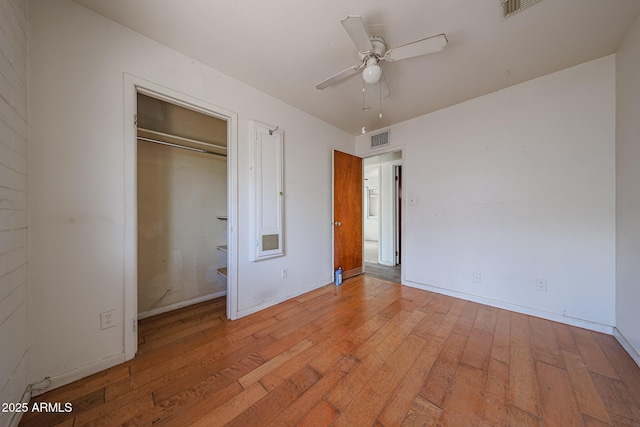 1614 S 6th Ave, Phoenix, AZ 85003 - unfurnished bedroom with wood-type flooring, baseboards, a closet, and a ceiling fan