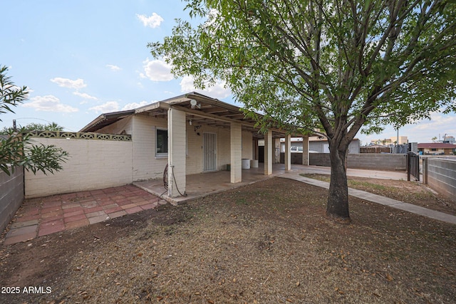 1614 S 6th Ave, Phoenix, AZ 85003 - back of house featuring a patio and a fenced backyard