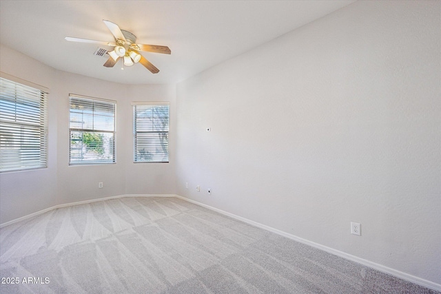 carpeted empty room with ceiling fan