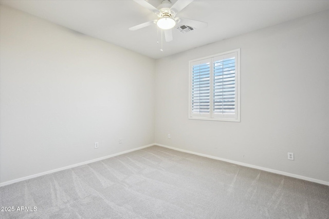 spare room with light carpet and ceiling fan