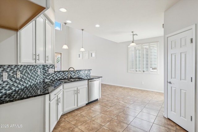 kitchen with stainless steel dishwasher, white cabinetry, sink, and hanging light fixtures