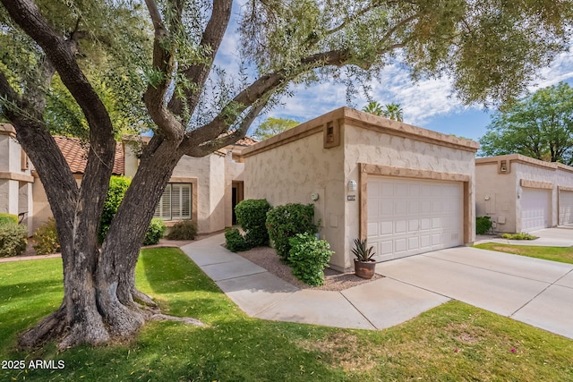 9128 W Kimberly Way, Peoria, AZ 85382 - view of front of property featuring stucco siding, an attached garage, concrete driveway, and a front yard